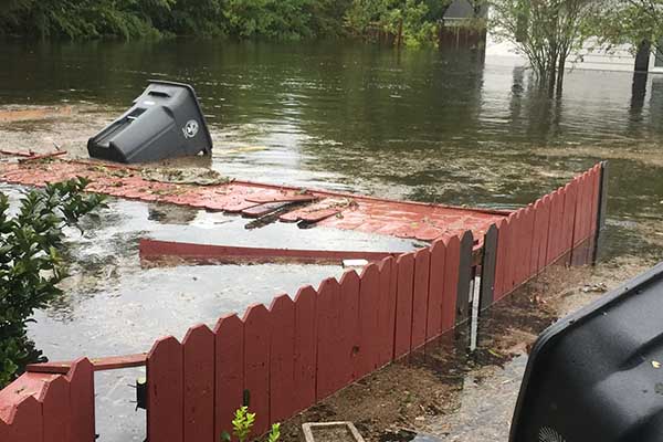 Flood waters destroy fence