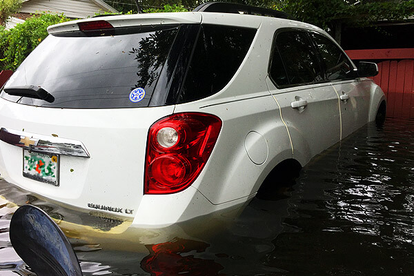 vehicle rendered useless by flooding waters